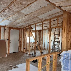 An image showing the interior of a student-built house under construction.